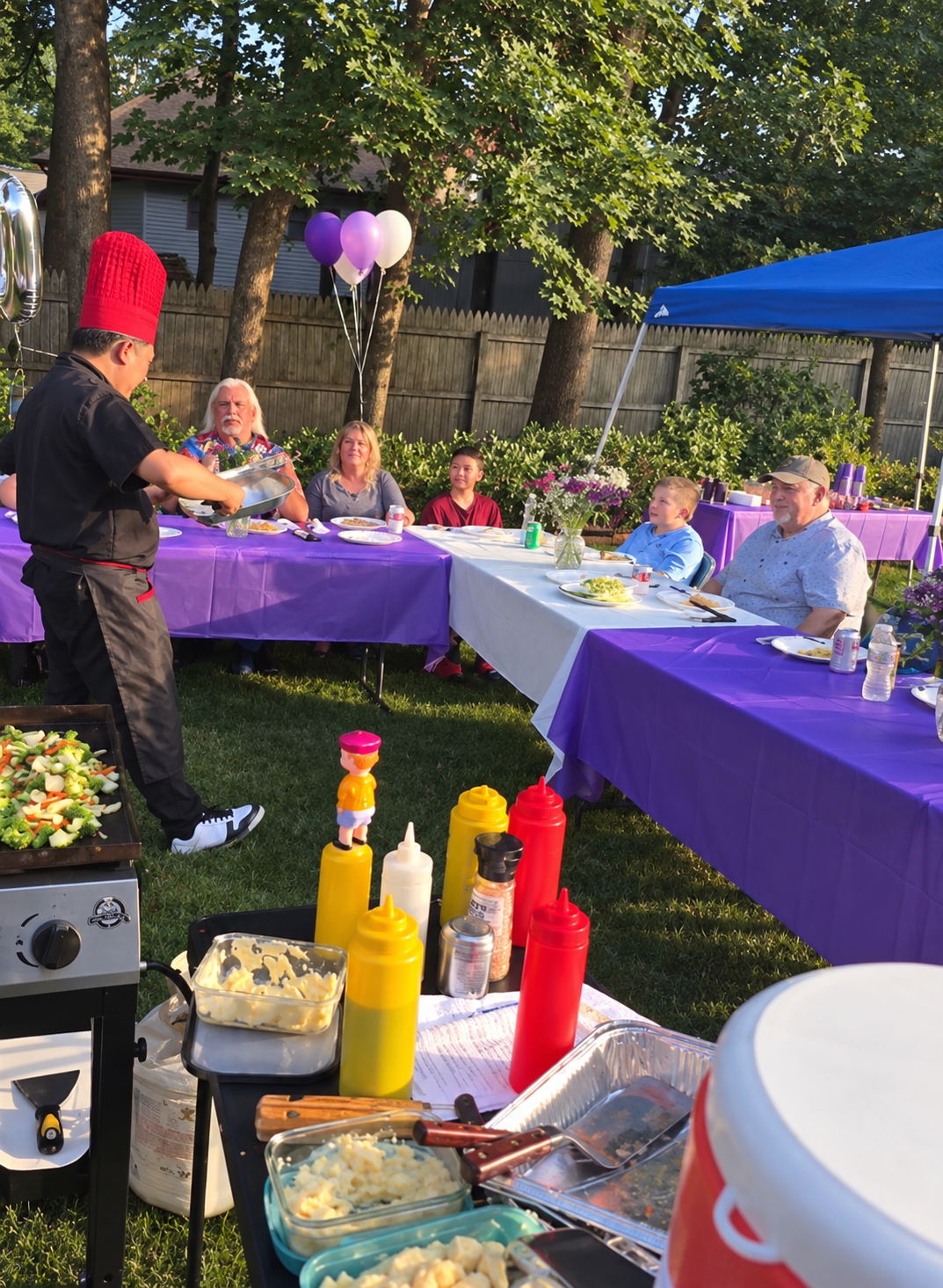Best Hibachi chef cooking for guests at a backyard hibachi party at home